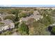 Aerial view of townhome community surrounded by mature trees and landscaping at 2851 Polvadero Ln # 107, Orlando, FL 32835