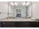 Bathroom features a double vanity with granite countertops and modern fixtures at 3167 Crown Jewel Ct, Winter Park, FL 32792