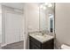 Half bathroom showing modern vanity with granite countertop and dark wood cabinets at 3167 Crown Jewel Ct, Winter Park, FL 32792