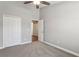 This bedroom features neutral walls and flooring, closet, and a ceiling fan for added comfort at 3167 Crown Jewel Ct, Winter Park, FL 32792