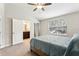 Inviting bedroom featuring access to an ensuite bathroom and a well-lit window at 3167 Crown Jewel Ct, Winter Park, FL 32792