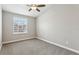 Bright, carpeted bedroom with a large window offering ample natural light at 3167 Crown Jewel Ct, Winter Park, FL 32792