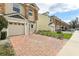 View of townhomes with brick paved driveways at 3167 Crown Jewel Ct, Winter Park, FL 32792