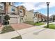 Townhomes with brick paved driveways and stone accents at 3167 Crown Jewel Ct, Winter Park, FL 32792