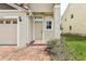 A welcoming entryway with a brick path and well-maintained landscaping at 3167 Crown Jewel Ct, Winter Park, FL 32792