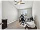 Bright home office space with neutral colors, a ceiling fan, and natural light from a window at 3167 Crown Jewel Ct, Winter Park, FL 32792