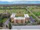 Aerial view of the condo complex with golf course and green landscape in the background at 325 Wilder Blvd # A404, Daytona Beach, FL 32114