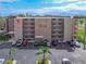 Exterior view of the condo complex highlighting its brick facade and ample parking at 325 Wilder Blvd # A404, Daytona Beach, FL 32114