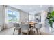 Bright dining area with large window and adjacent modern kitchen at 3603 Salvia Ct, Tavares, FL 32778