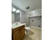 Functional bathroom features a sink with wooden vanity and a toilet at 4154 Pinebark Ave # 3, Orlando, FL 32811