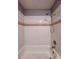 Bathtub and shower with neutral tile walls at 4154 Pinebark Ave # 3, Orlando, FL 32811