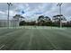 Fenced in tennis court with painted court lines for recreational enjoyment at 4154 Pinebark Ave # 3, Orlando, FL 32811