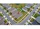 An aerial view showcases a neighborhood with well-maintained lawns and a tranquil pond at 5593 Vigo Loop, St Cloud, FL 34771