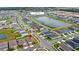 Aerial view of the community showcasing the water view, and the neighborhood layout at 5593 Vigo Loop, St Cloud, FL 34771