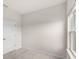 Clean, minimalist bedroom with a view from the window and a white interior door at 5593 Vigo Loop, St Cloud, FL 34771