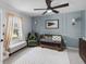 Serene Bedroom featuring a chair, a striped accent wall, and coordinated decor at 5663 Keaton Springs Dr, Lakeland, FL 33811