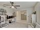 Carpeted bedroom featuring a ceiling fan and a desk at 5663 Keaton Springs Dr, Lakeland, FL 33811