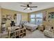 Bedroom with a ceiling fan and window overlooking a great view and natural light at 5663 Keaton Springs Dr, Lakeland, FL 33811