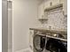 Convenient laundry room featuring modern washer and dryer units at 5663 Keaton Springs Dr, Lakeland, FL 33811