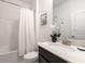 Bathroom with tub and shower combination, white vanity, and modern fixtures at 695 Whistling Straits Blvd, Davenport, FL 33896