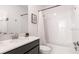 Bathroom featuring vanity with dark cabinets, white countertops and shower-tub combination at 695 Whistling Straits Blvd, Davenport, FL 33896