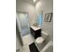 Clean bathroom featuring a white sink, toilet, and tile flooring at 695 Whistling Straits Blvd, Davenport, FL 33896