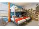 ' bedroom with bunk beds, orange accents, and Toy Story themed wall art at 695 Whistling Straits Blvd, Davenport, FL 33896