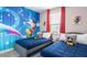 This vibrant bedroom features colorful Disney-themed decor and twin beds at 695 Whistling Straits Blvd, Davenport, FL 33896