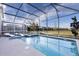 Inviting pool area with lounge chairs, jacuzzi, and serene views of the outdoors at 695 Whistling Straits Blvd, Davenport, FL 33896