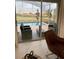 View of a screened-in pool area with outdoor seating, accessible from inside at 695 Whistling Straits Blvd, Davenport, FL 33896