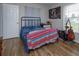 Cozy bedroom featuring wood floors and natural light at 711 Montana Ave, St Cloud, FL 34769