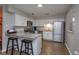 Modern kitchen featuring stainless steel appliances, granite countertops, and a breakfast bar at 711 Montana Ave, St Cloud, FL 34769