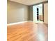 This bedroom features wood-look laminate floors and a closet, adjacent to the ensuite at 722 Eagle Ave, Longwood, FL 32750