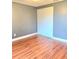 This bedroom has wood-look laminate floors and a sliding-door closet at 722 Eagle Ave, Longwood, FL 32750