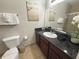 Well maintained bathroom features a large mirror and a granite vanity with sink and bathroom accessories at 8010 Tuscany Way # 5206, Davenport, FL 33896