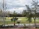 Scenic golf course view with sand trap, pond and lush greenery at 8010 Tuscany Way # 5206, Davenport, FL 33896