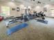 Bright gym with exercise machines, weights, and yoga mats at 8010 Tuscany Way # 5206, Davenport, FL 33896