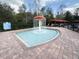 Outdoor kiddie pool with mushroom fountain, patio, and surrounding cabanas at 8010 Tuscany Way # 5206, Davenport, FL 33896