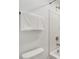 Bathroom shower and toilet with white walls at 8903 Caroline Bay Ct, Kissimmee, FL 34747