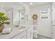 Bright bathroom with white cabinets, a large mirror, and modern decor at 8903 Caroline Bay Ct, Kissimmee, FL 34747