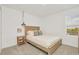 Bedroom with a wood bedframe, a small bedside table and a light fixture at 8903 Caroline Bay Ct, Kissimmee, FL 34747