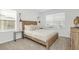 Comfortable bedroom featuring a queen bed and modern industrial lighting at 8903 Caroline Bay Ct, Kissimmee, FL 34747