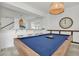 Pool table in recreation room featuring a modern hanging light fixture and bar area at 8903 Caroline Bay Ct, Kissimmee, FL 34747