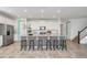 Modern eat-in kitchen with black and white tile on breakfast bar and white subway tile backsplash at 8903 Caroline Bay Ct, Kissimmee, FL 34747