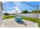 Backyard patio with a seating area, string lights, and a relaxing water view at 905 Bella Vista Way, Orlando, FL 32825