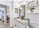 Bathroom displaying modern vanity with granite countertop, mosaic tiles, and decorative shelving at 905 Bella Vista Way, Orlando, FL 32825