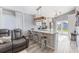 Contemporary kitchen featuring an island with barstool seating and modern pendant lighting at 905 Bella Vista Way, Orlando, FL 32825