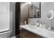 Modern bathroom featuring sleek vanity, updated mirror, and neutral color palette at 910 Florida Blvd, Altamonte Springs, FL 32701