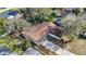 An aerial view of a single Gathering home featuring a driveway and mature trees at 921 W Lake Brantley Rd, Altamonte Springs, FL 32714