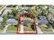 A single Gathering home, outlined in red, has a long driveway and is surrounded by mature trees and other homes at 921 W Lake Brantley Rd, Altamonte Springs, FL 32714